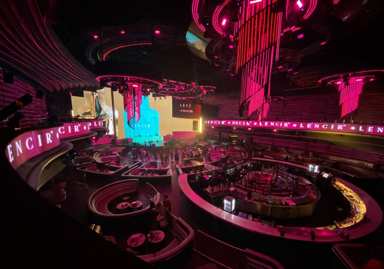 The Lencir launch venue, its neon signage wrapping the room